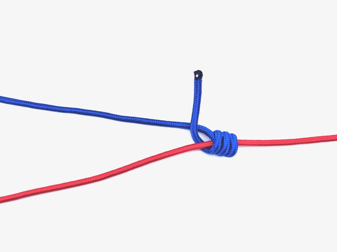 Step 5 of tying the Blood Knot knot - detailed visual instruction