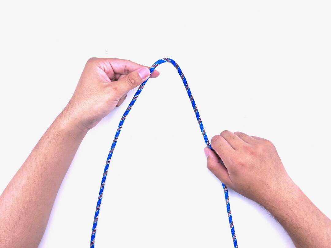 Step 1 of tying the Boa Knot knot - detailed visual instruction