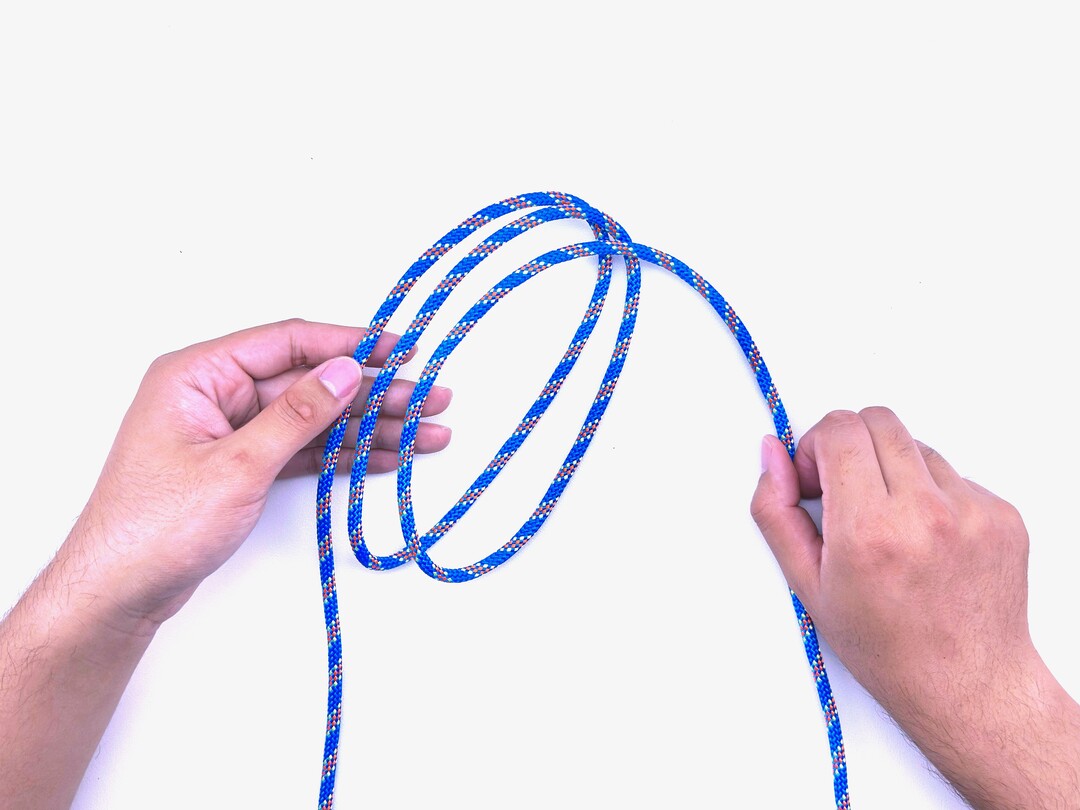 Step 2 of tying the Boa Knot knot - detailed visual instruction