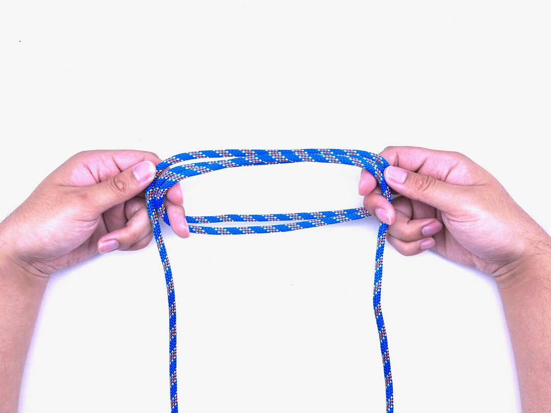 Step 3 of tying the Boa Knot knot - detailed visual instruction