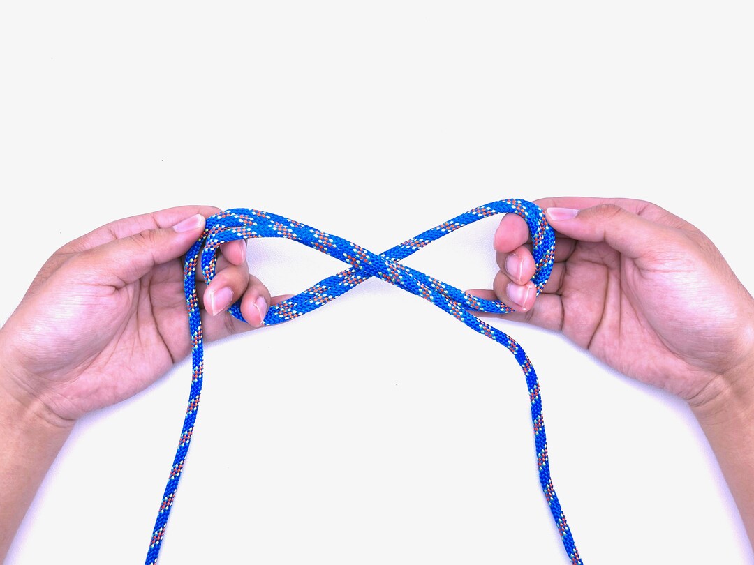 Step 4 of tying the Boa Knot knot - detailed visual instruction