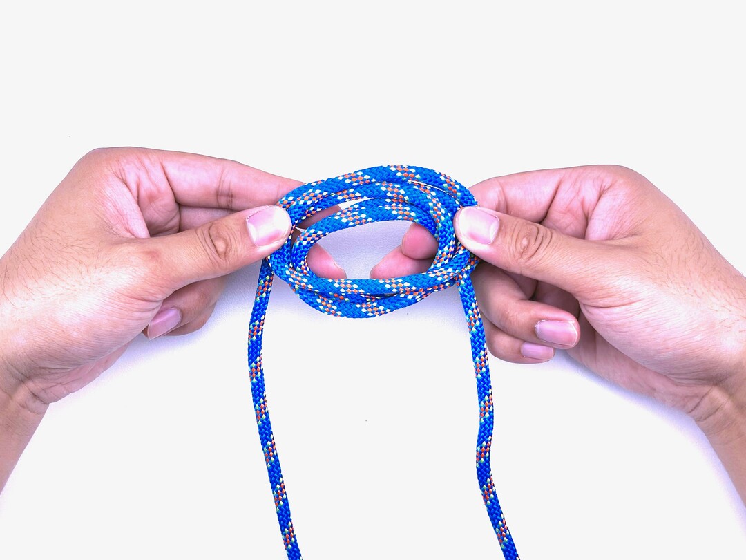 Step 6 of tying the Boa Knot knot - detailed visual instruction