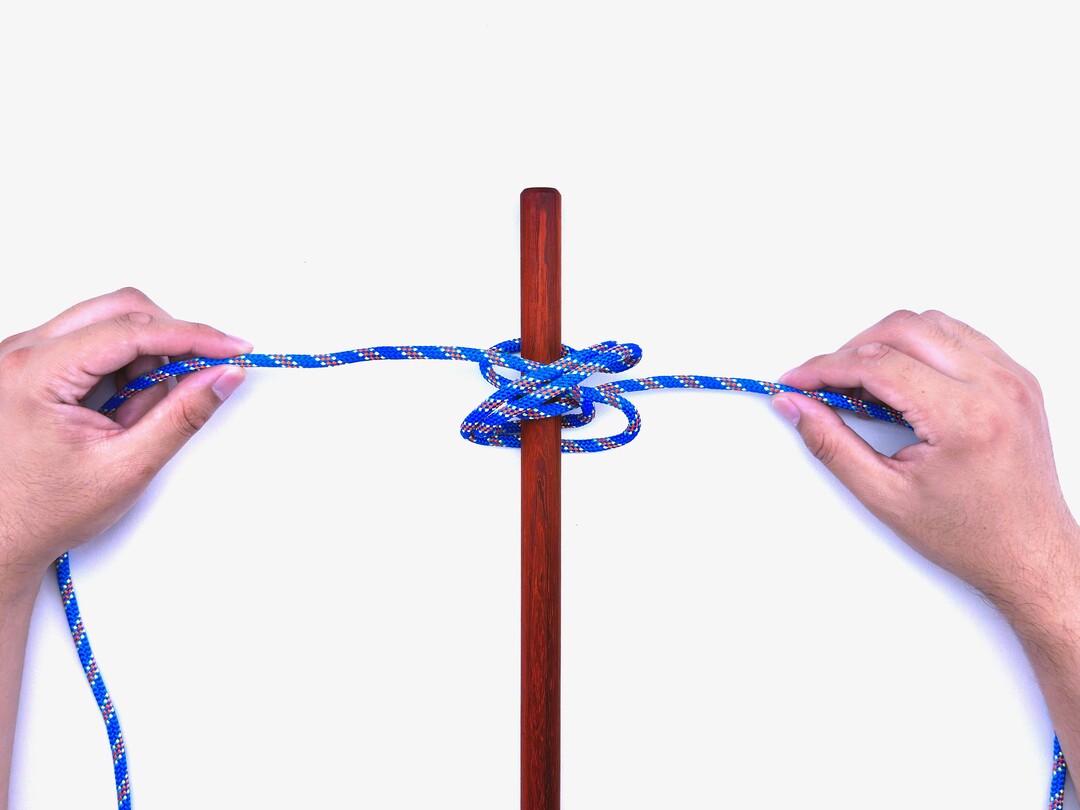Step 7 of tying the Boa Knot knot - detailed visual instruction