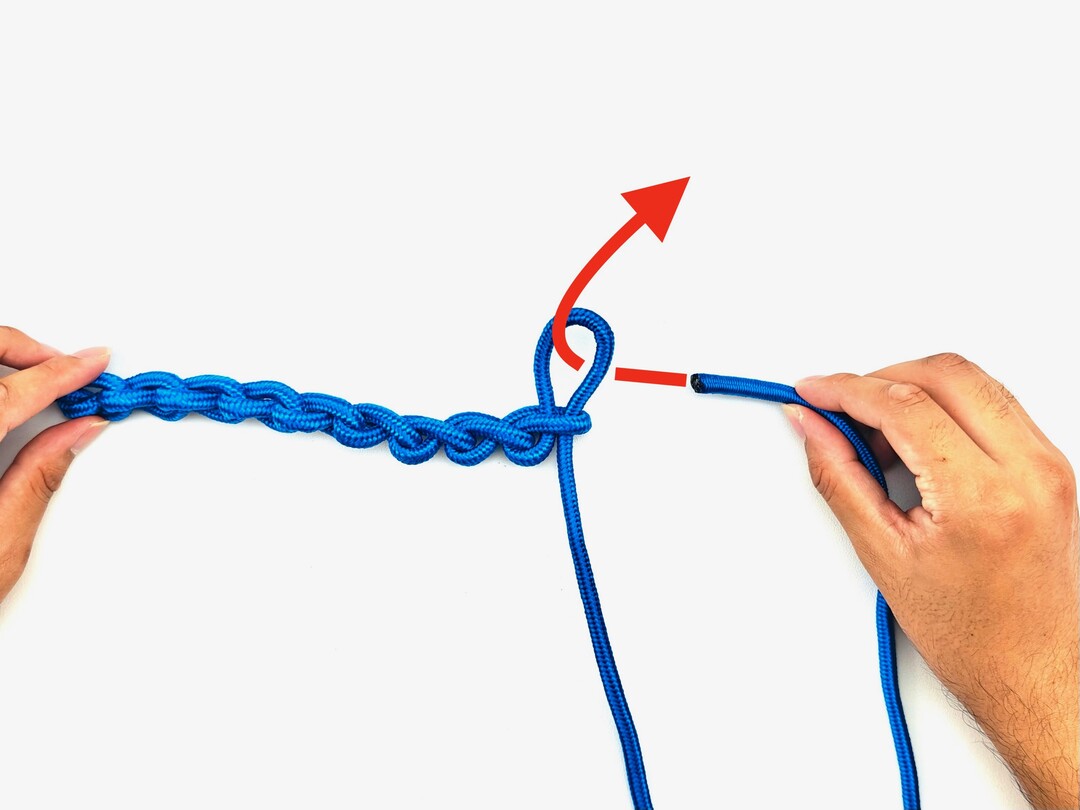 Step 8 of tying the Chain Sinnet knot - detailed visual instruction