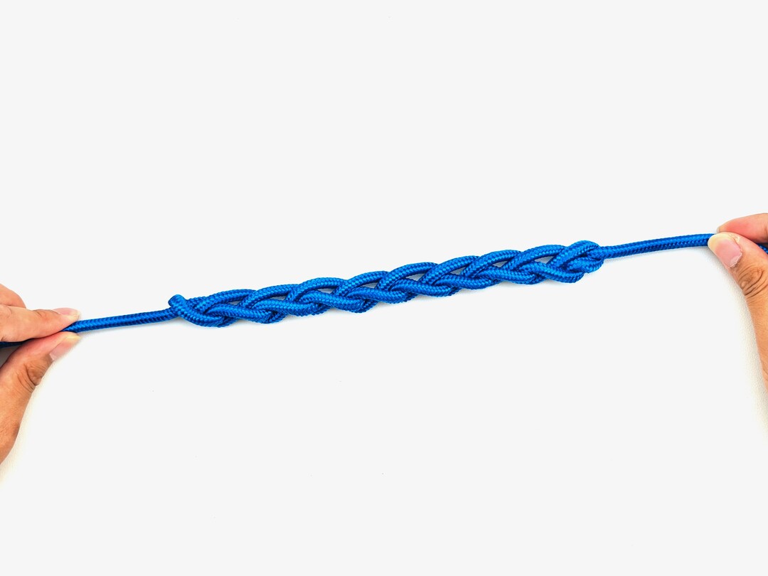 Step 9 of tying the Chain Sinnet knot - detailed visual instruction
