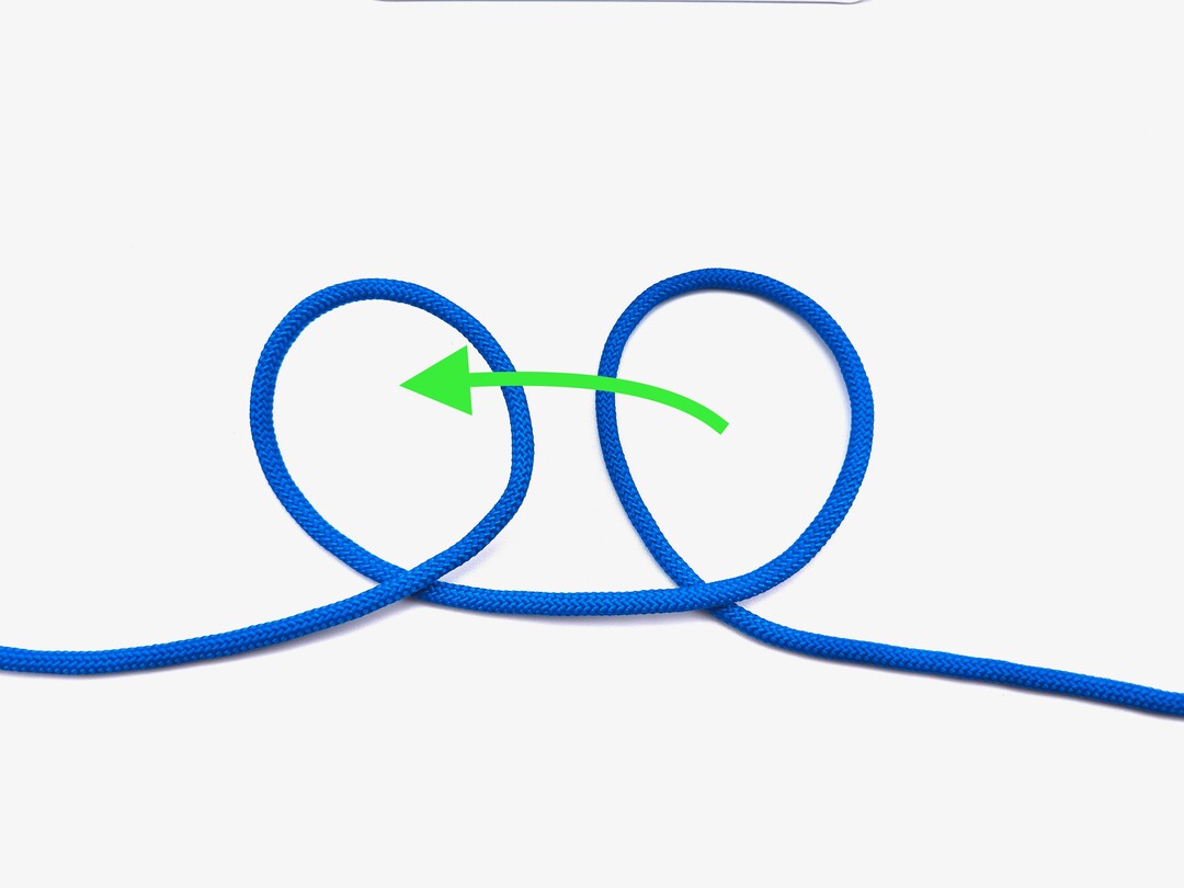 Step 2 of tying the Clove Hitch (Middle of Rope) knot - detailed visual instruction