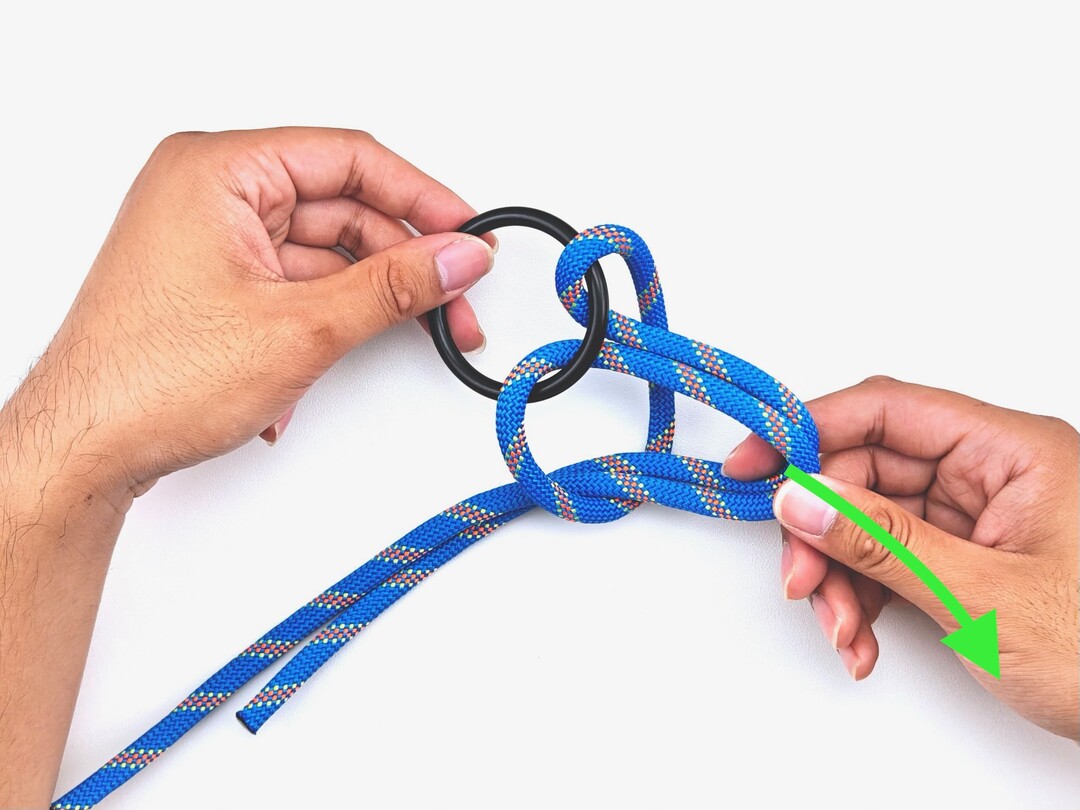 Step 3 of tying the Cow Hitch knot - detailed visual instruction