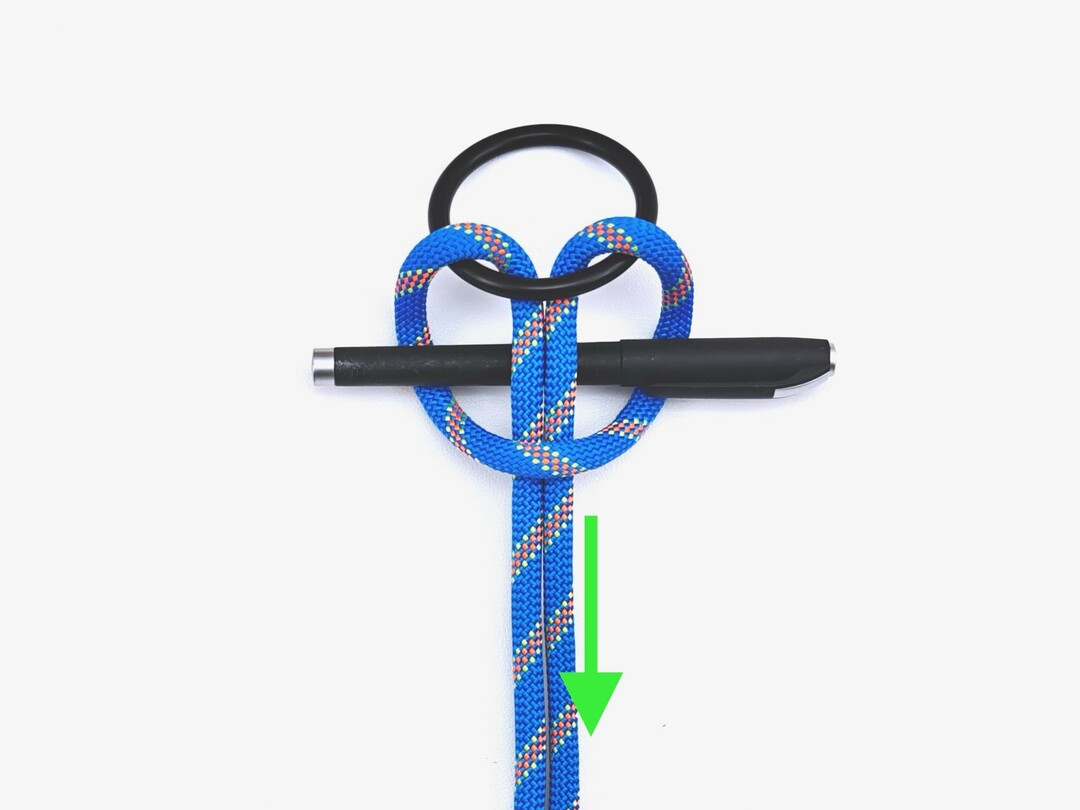 Step 3 of tying the Cow Hitch with Toggle knot - detailed visual instruction