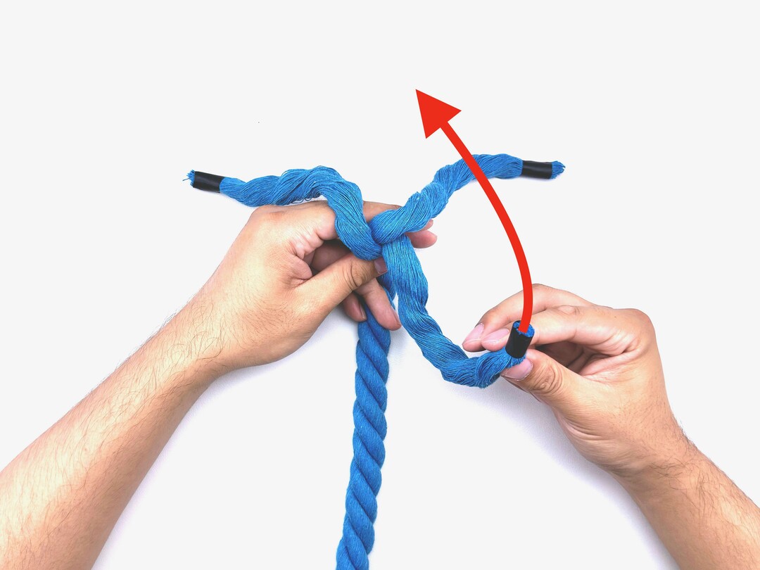 Step 2 of tying the Crown Knot knot - detailed visual instruction