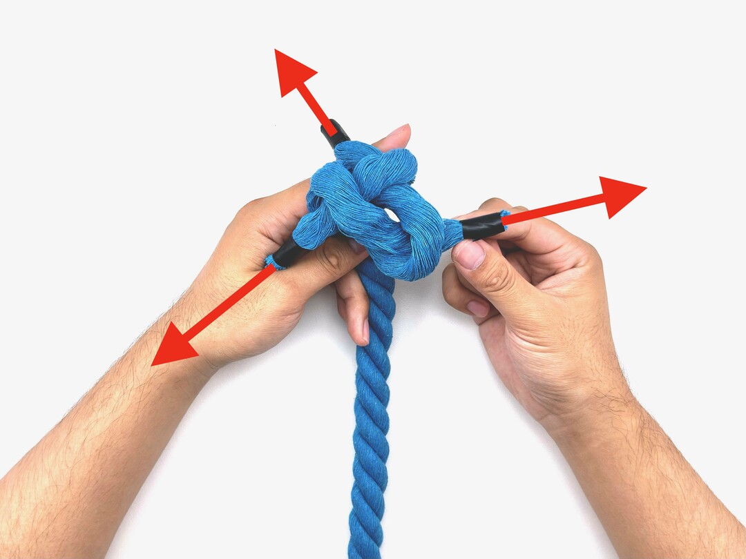 Step 5 of tying the Crown Knot knot - detailed visual instruction