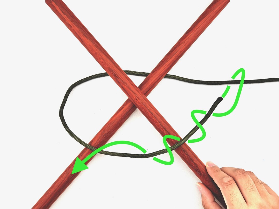 Step 1 of tying the Diagonal Lashing knot - detailed visual instruction