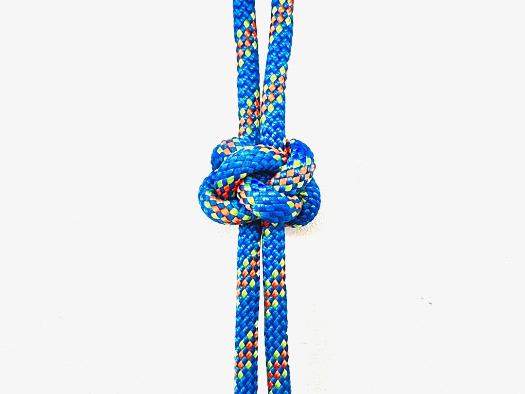 Step 2 of tying the Diamond Knot knot - detailed visual instruction