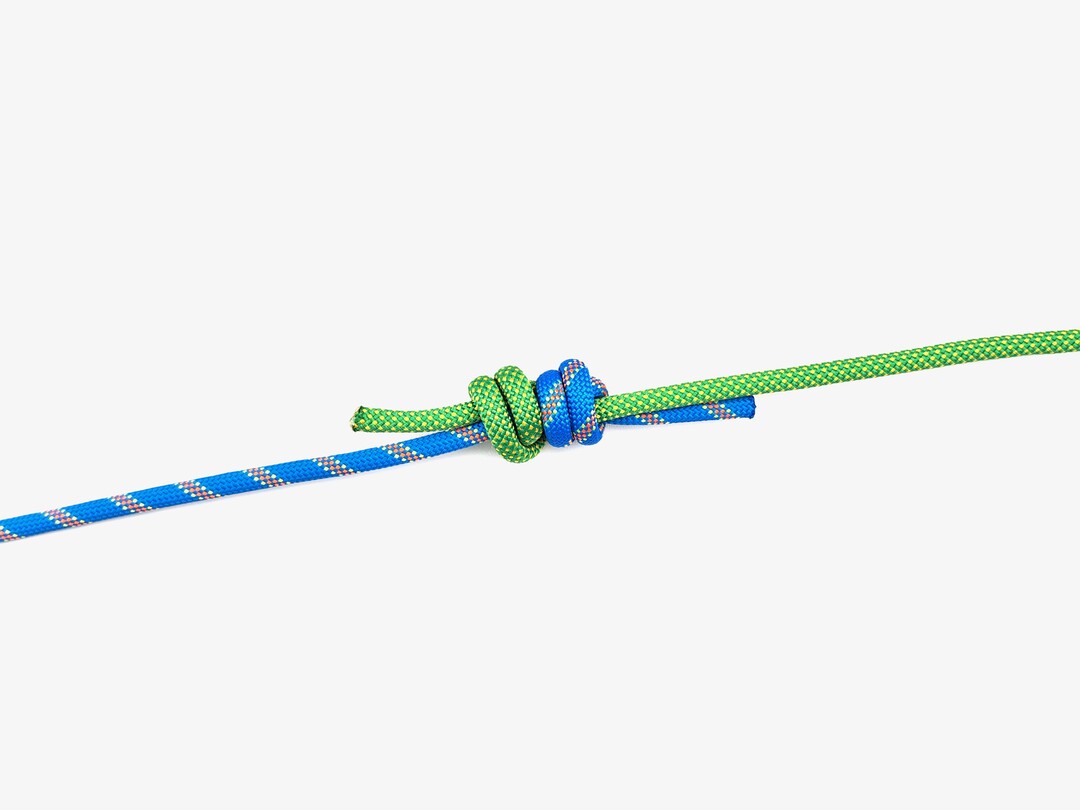 Step 11 of tying the Double Fisherman's Knot knot - detailed visual instruction