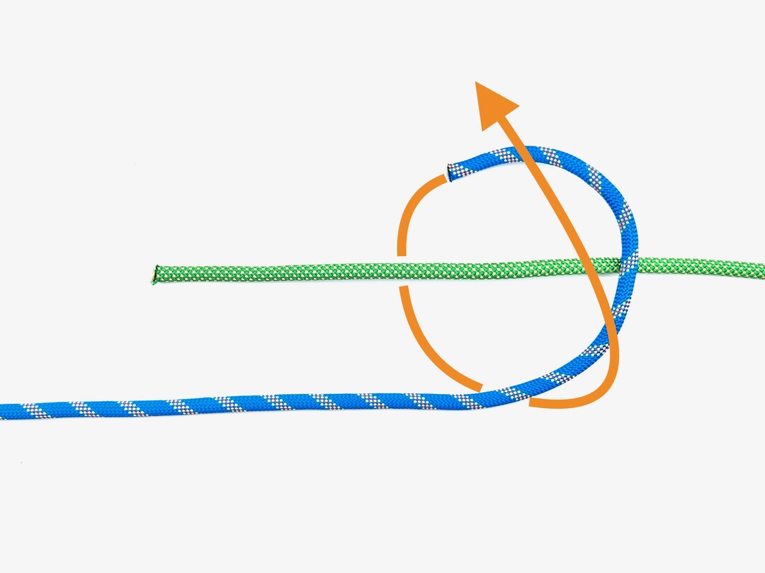 Step 2 of tying the Double Fisherman's Knot knot - detailed visual instruction