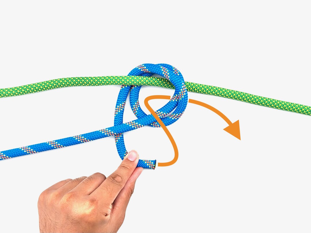 Step 4 of tying the Double Fisherman's Knot knot - detailed visual instruction