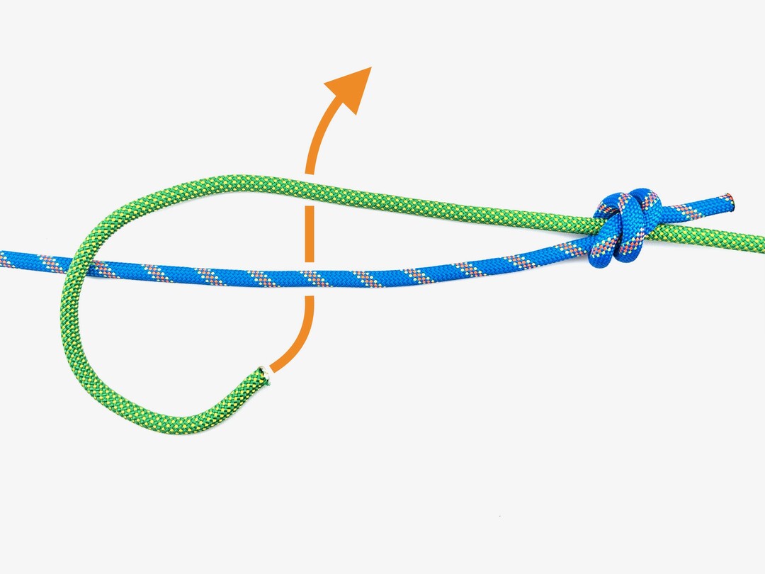 Step 6 of tying the Double Fisherman's Knot knot - detailed visual instruction