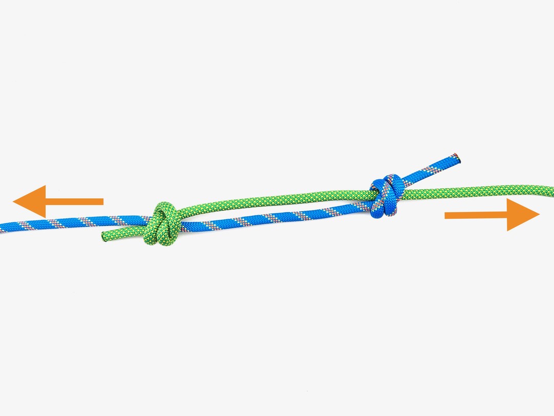 Step 10 of tying the Double Fisherman's Knot knot - detailed visual instruction