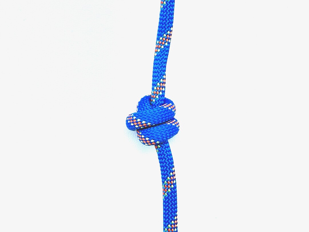 Step 1 of tying the Double Overhand Knot knot - detailed visual instruction