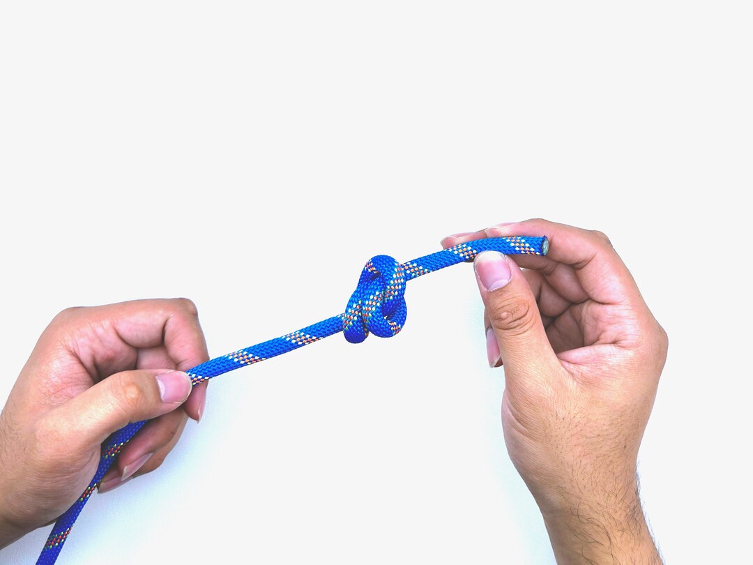 Step 6 of tying the Double Overhand Knot knot - detailed visual instruction
