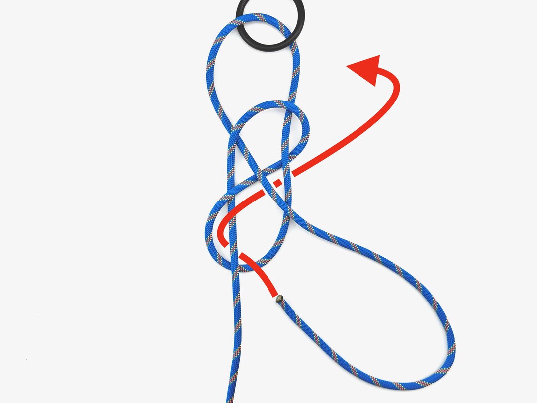 Step 5 of tying the Figure Eight Follow Through knot - detailed visual instruction