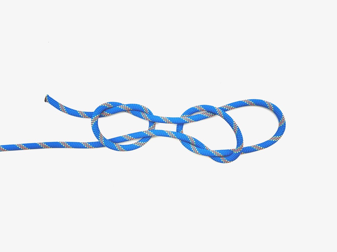 Step 5 of tying the Fisherman's Loop knot - detailed visual instruction