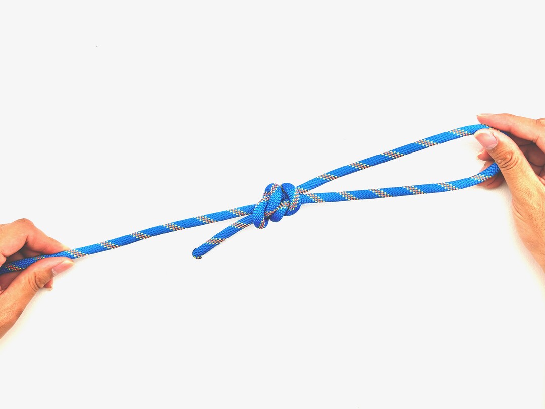 Step 7 of tying the Fisherman's Loop knot - detailed visual instruction
