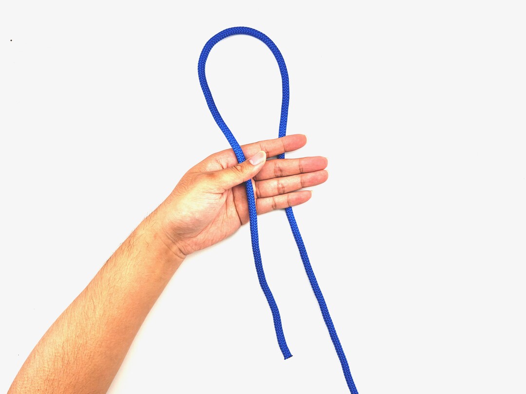 Step 1 of tying the Gasket Coil knot - detailed visual instruction