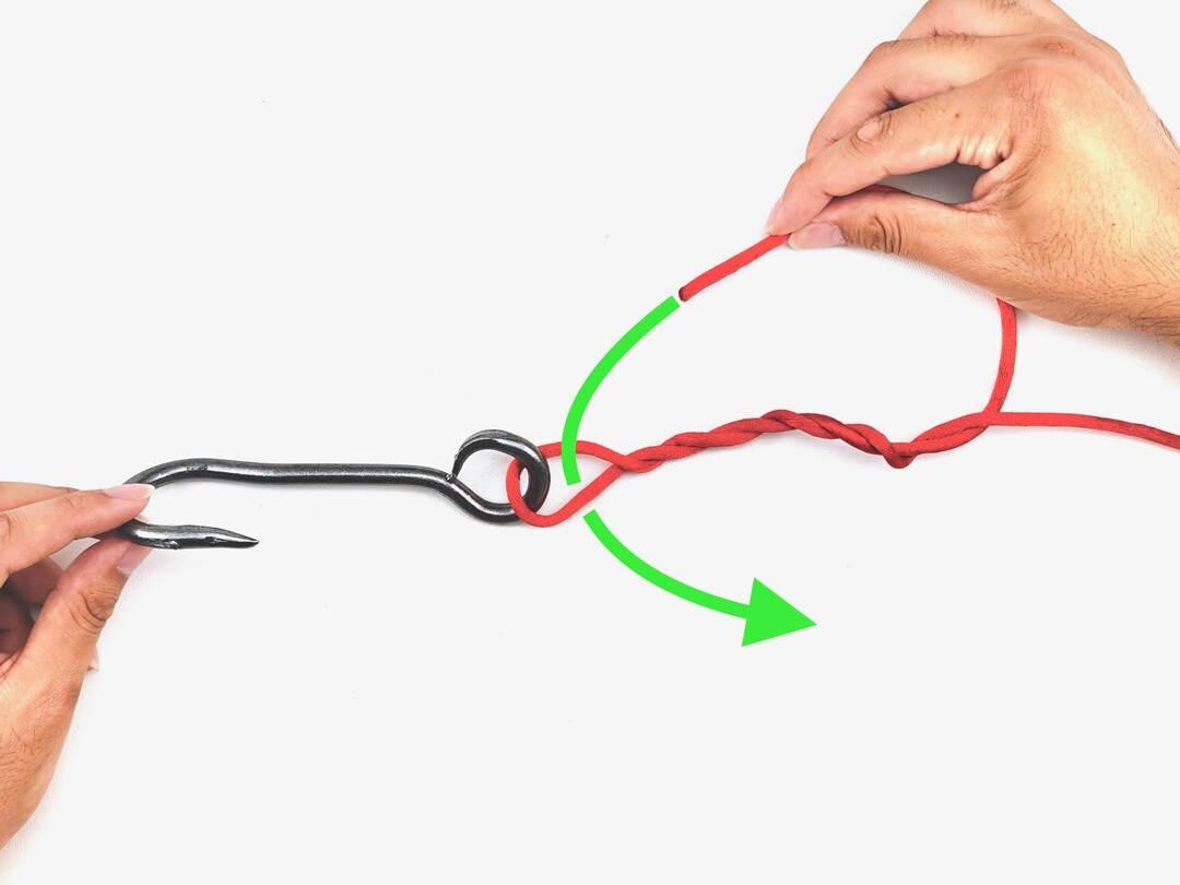Step 2 of tying the Improved Clinch Knot knot - detailed visual instruction