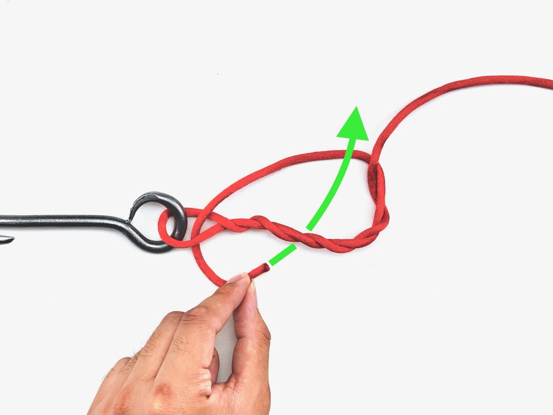 Step 3 of tying the Improved Clinch Knot knot - detailed visual instruction