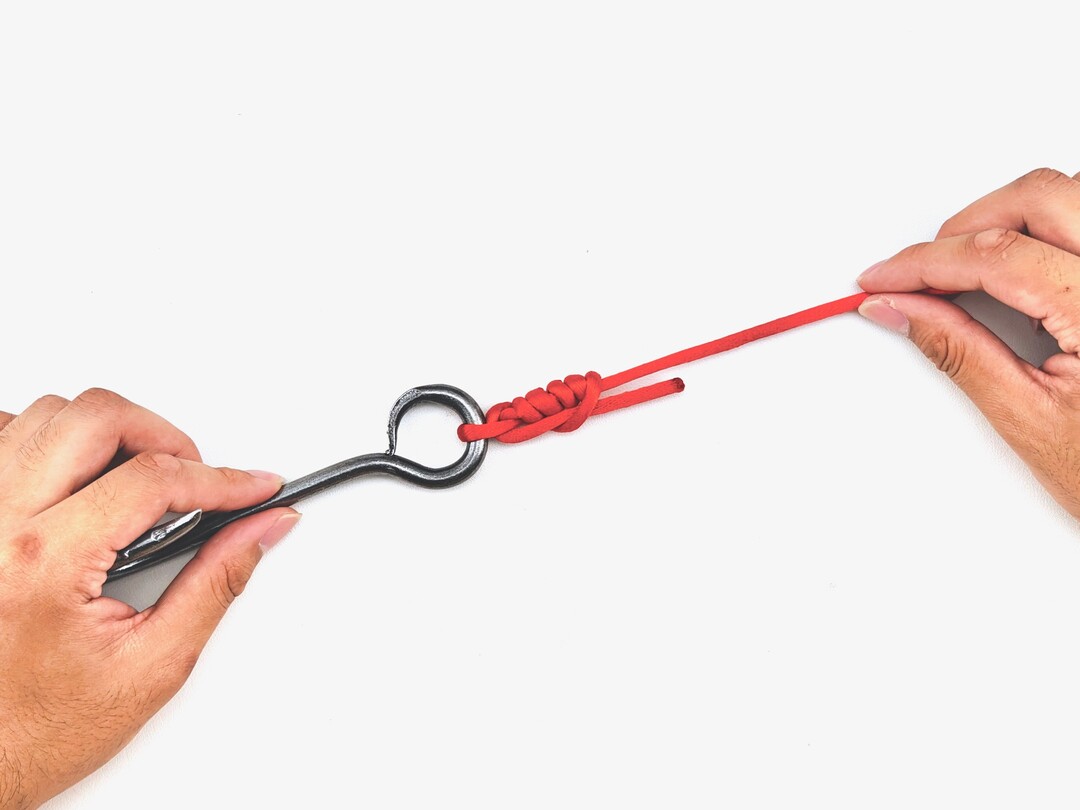 Step 5 of tying the Improved Clinch Knot knot - detailed visual instruction