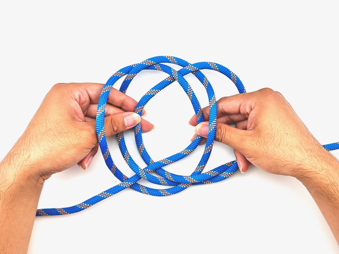 Step 3 of tying the Jury Mast Knot knot - detailed visual instruction
