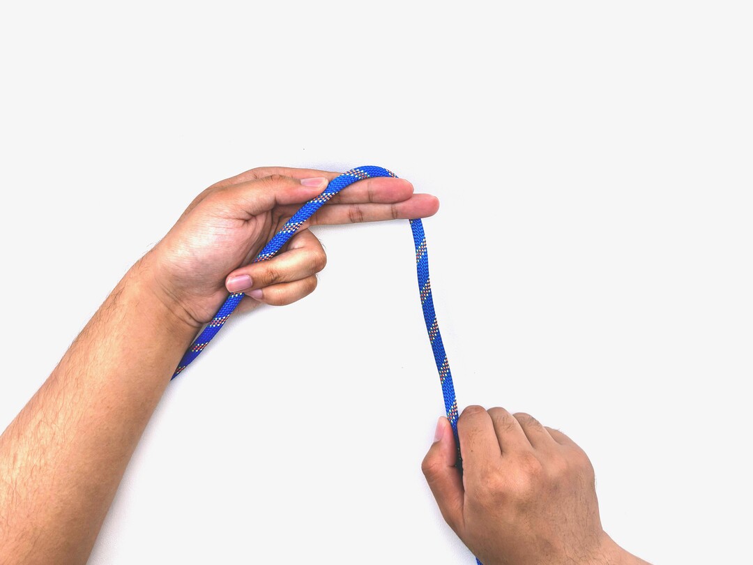 Step 3 of tying the Multiple Overhand Knot knot - detailed visual instruction
