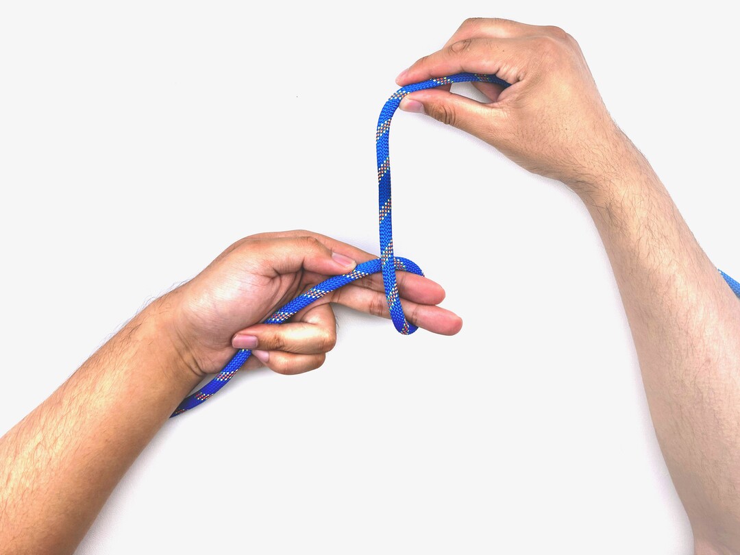 Step 4 of tying the Multiple Overhand Knot knot - detailed visual instruction