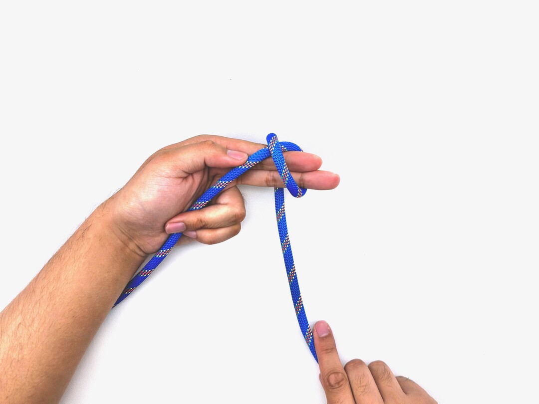 Step 5 of tying the Multiple Overhand Knot knot - detailed visual instruction