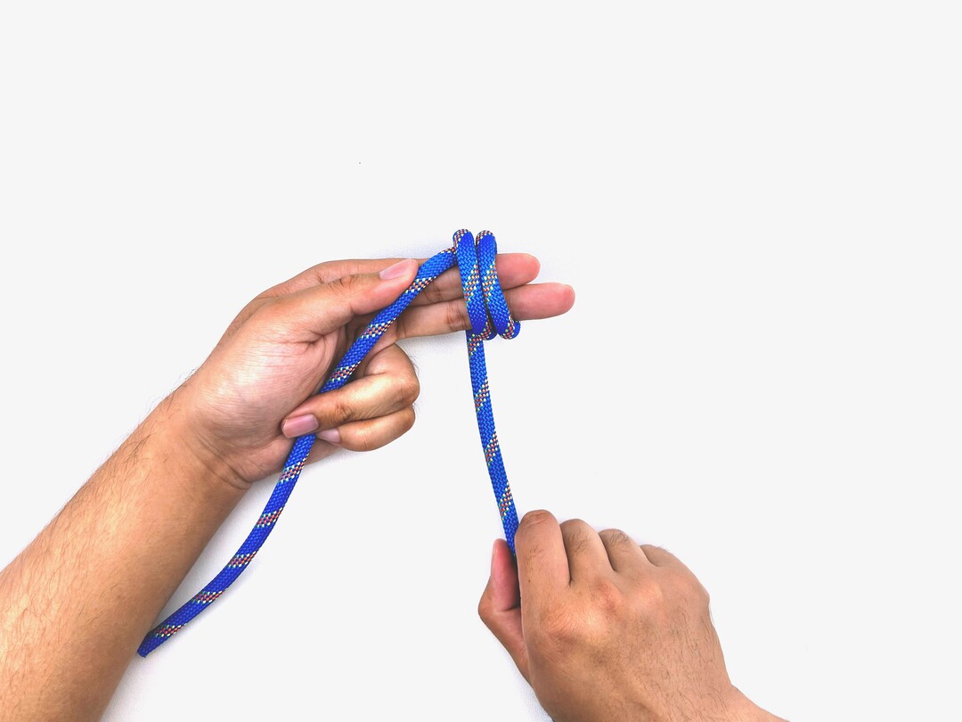 Step 6 of tying the Multiple Overhand Knot knot - detailed visual instruction