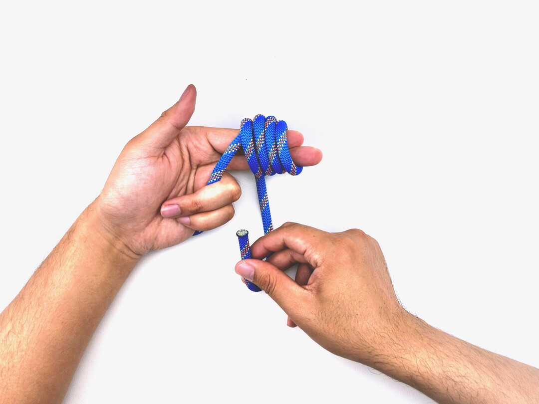 Step 7 of tying the Multiple Overhand Knot knot - detailed visual instruction
