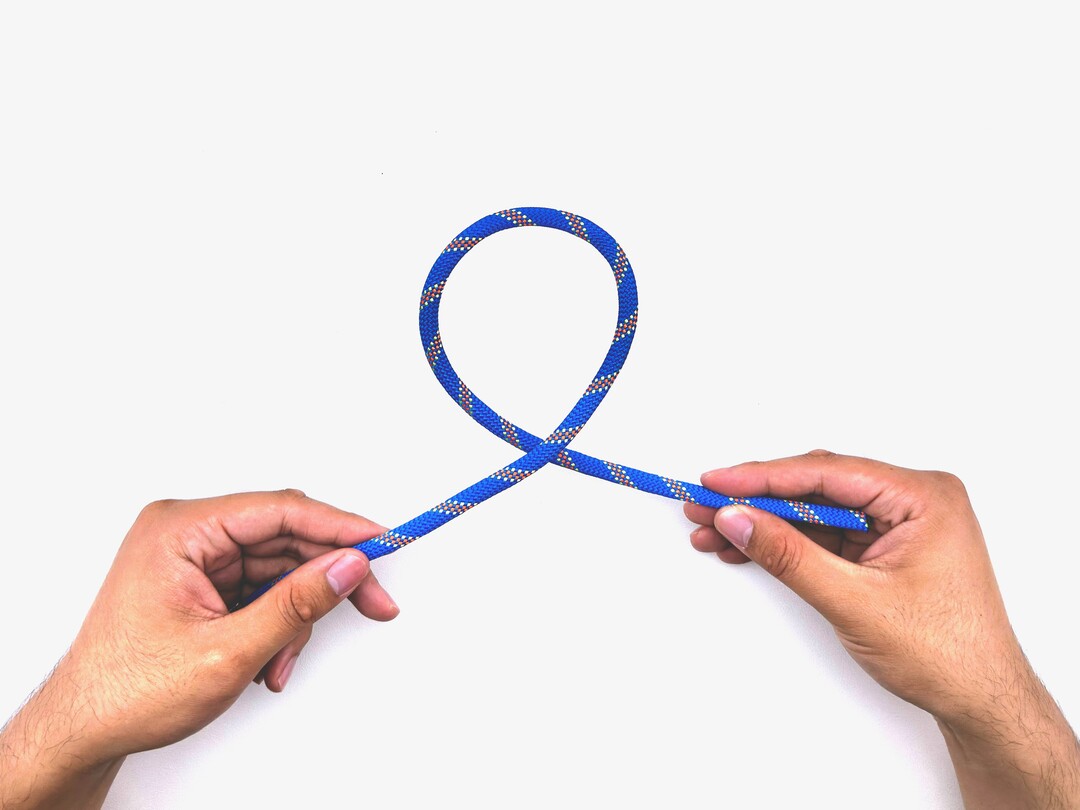 Step 2 of tying the Overhand Knot knot - detailed visual instruction
