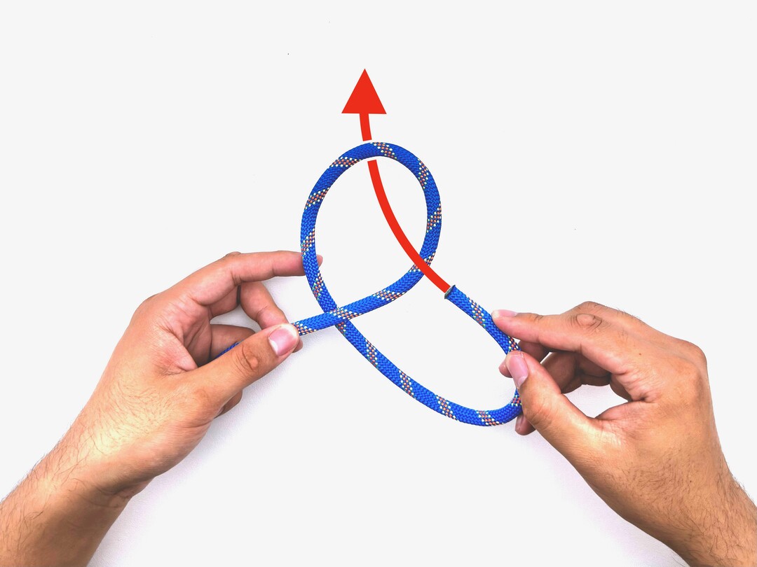 Step 3 of tying the Overhand Knot knot - detailed visual instruction
