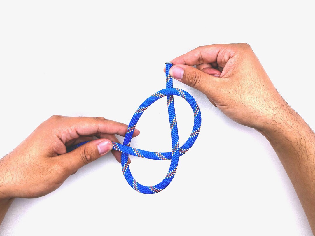 Step 4 of tying the Overhand Knot knot - detailed visual instruction