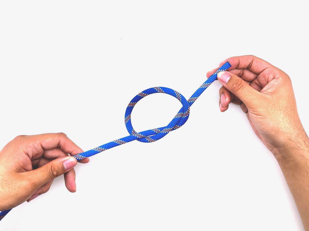 Step 5 of tying the Overhand Knot knot - detailed visual instruction