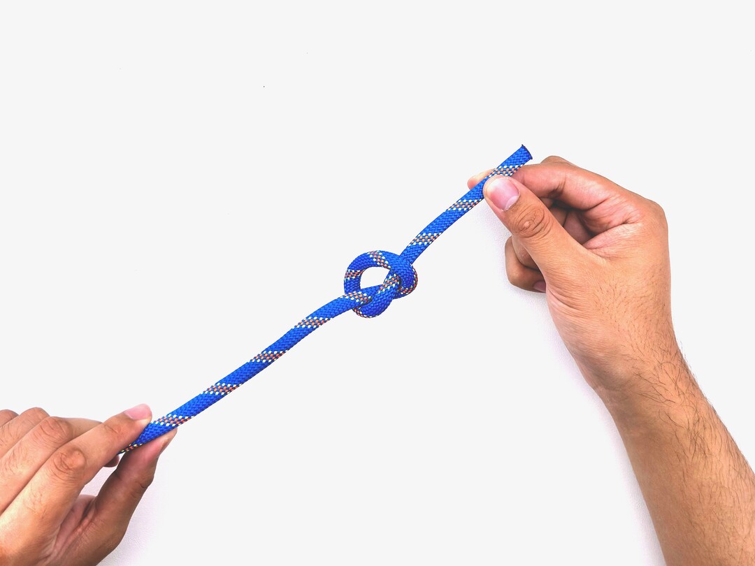 Step 6 of tying the Overhand Knot knot - detailed visual instruction