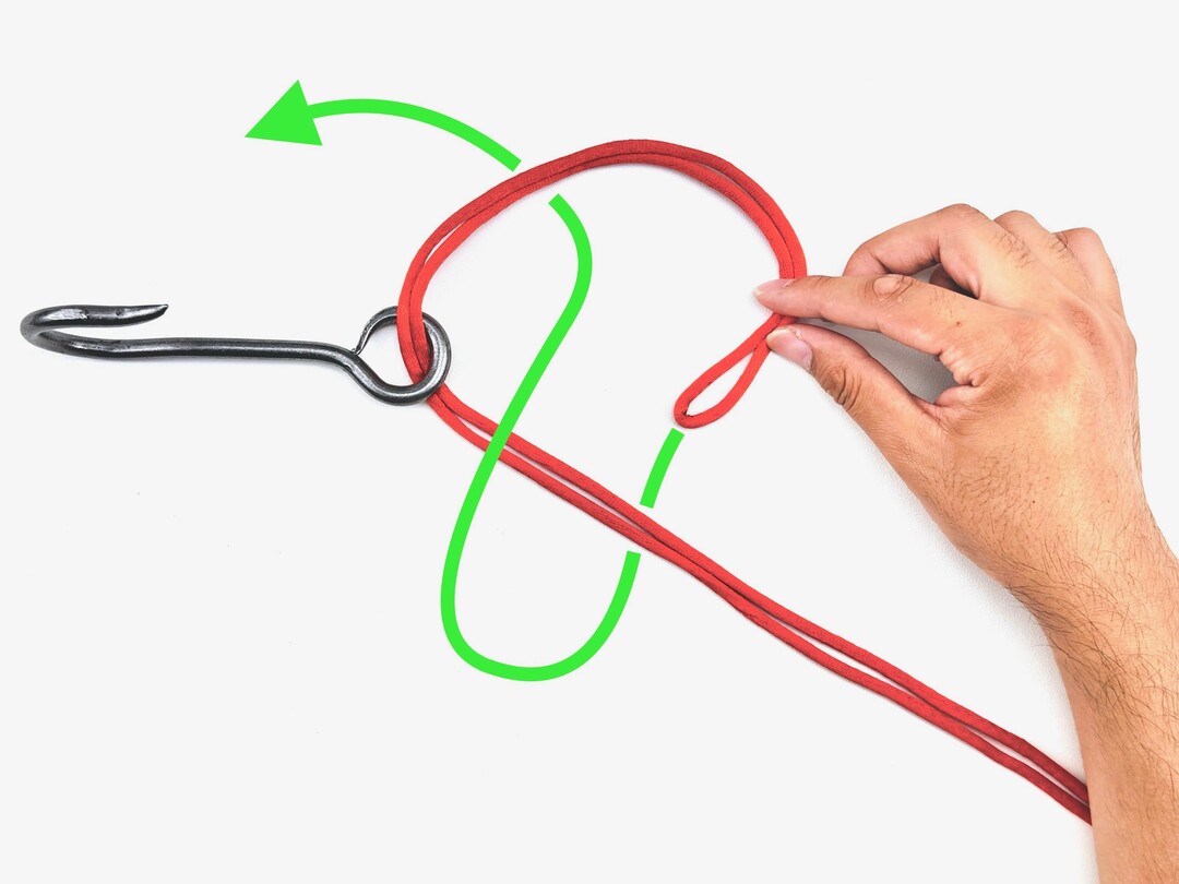 Step 2 of tying the Palomar Knot knot - detailed visual instruction