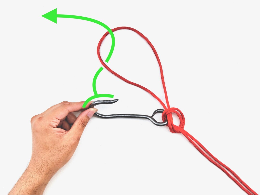 Step 3 of tying the Palomar Knot knot - detailed visual instruction