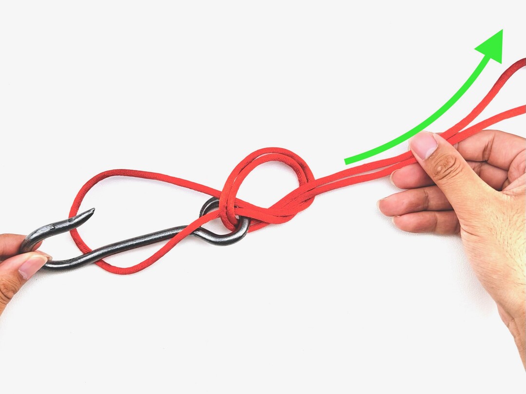 Step 4 of tying the Palomar Knot knot - detailed visual instruction