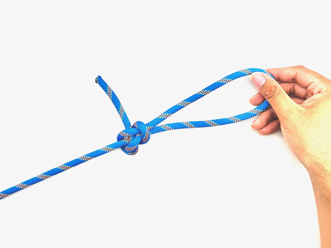 Step 5 of tying the Perfection Loop knot - detailed visual instruction