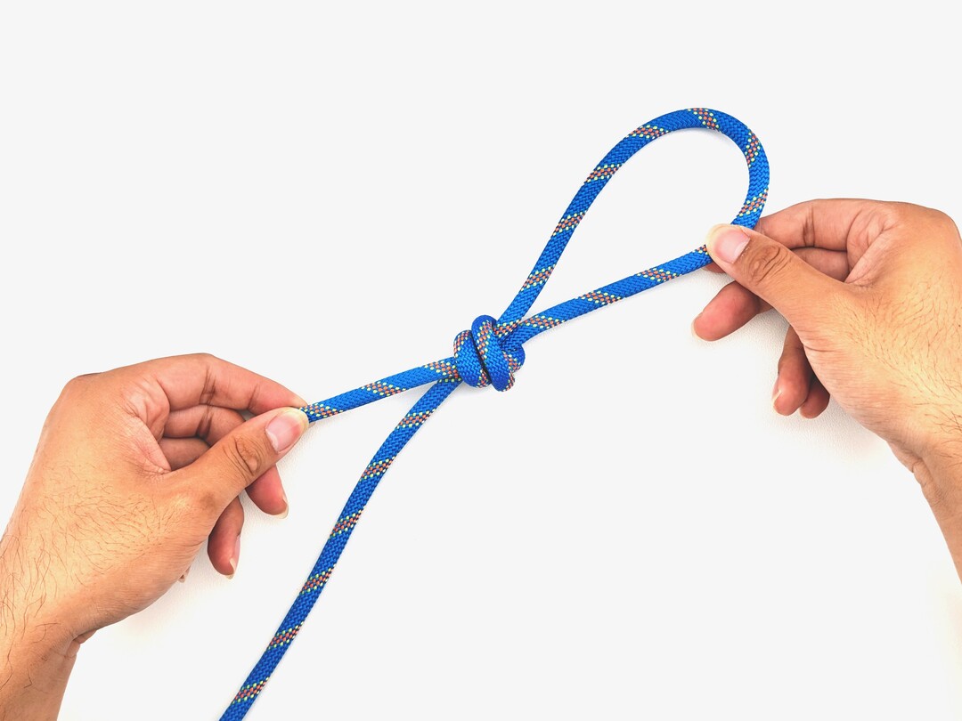 Step 7 of tying the Poacher's Knot knot - detailed visual instruction