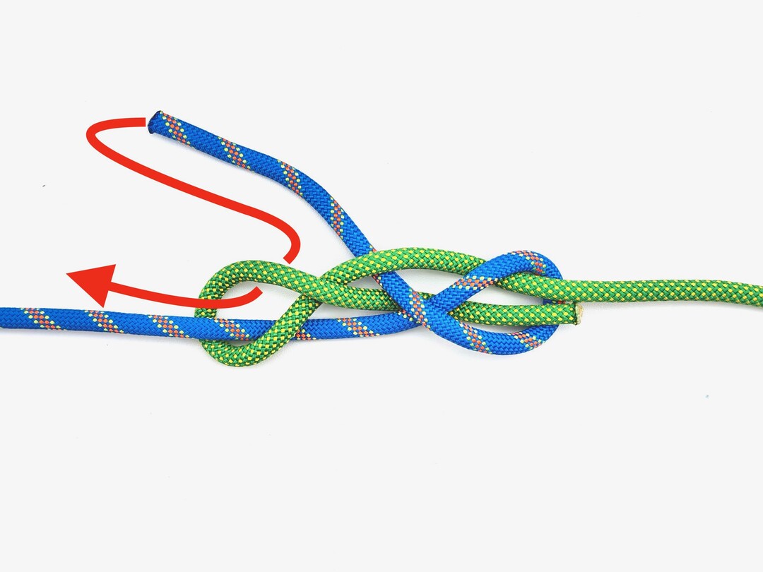 Step 5 of tying the Reever Knot knot - detailed visual instruction