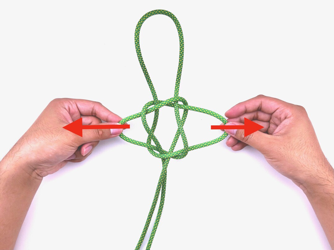Step 11 of tying the Sailor's Cross knot - detailed visual instruction