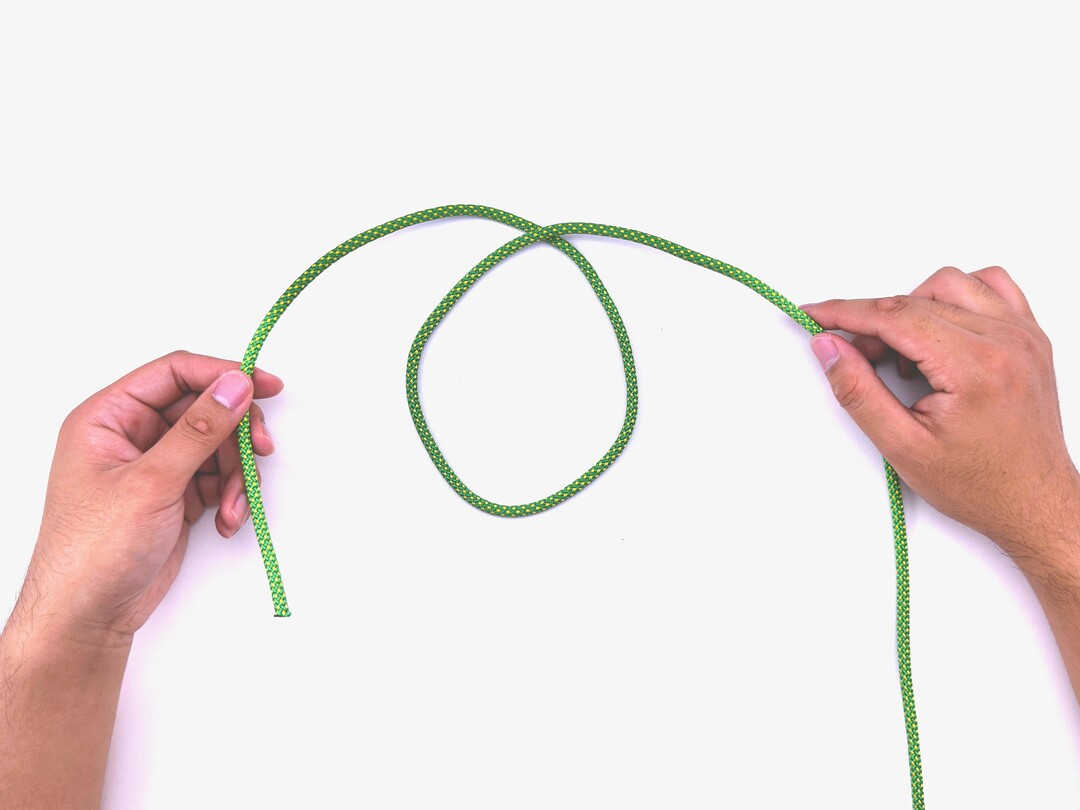 Step 2 of tying the Sailor's Cross knot - detailed visual instruction