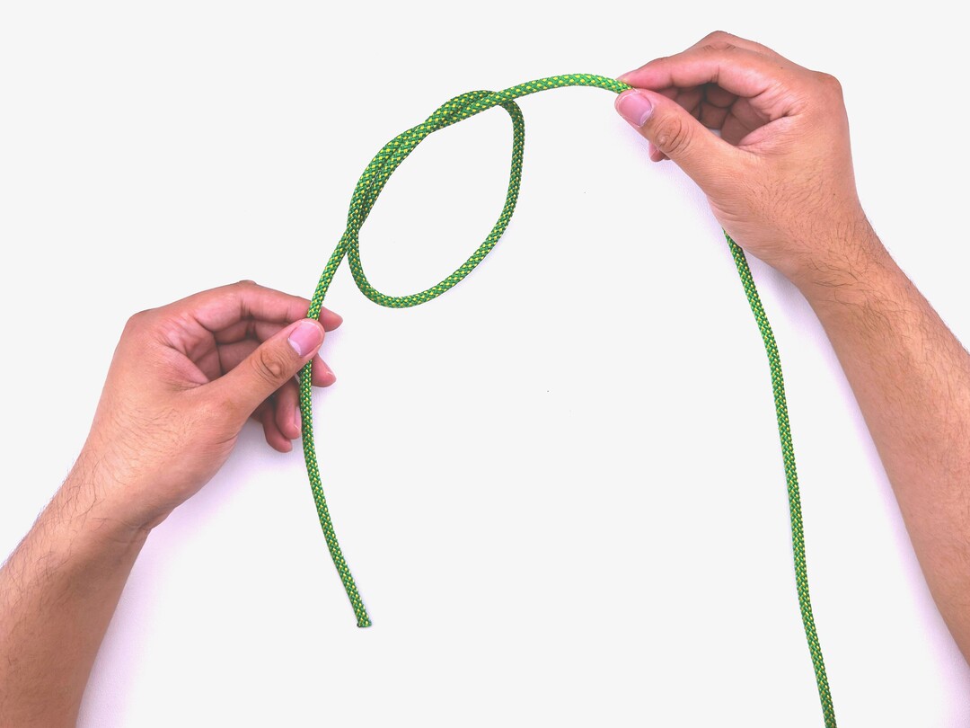 Step 4 of tying the Sailor's Cross knot - detailed visual instruction